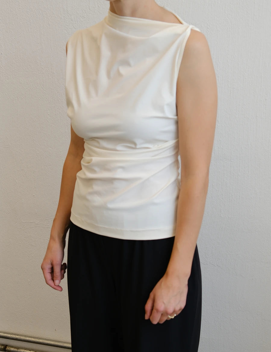 Reyem-Asymmetric-Sleeveless-Top-Cream-Model-Sideview.webp